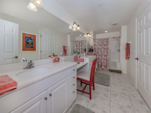 full bath featuring baseboards, vanity, a shower with shower curtain, and tile patterned floors