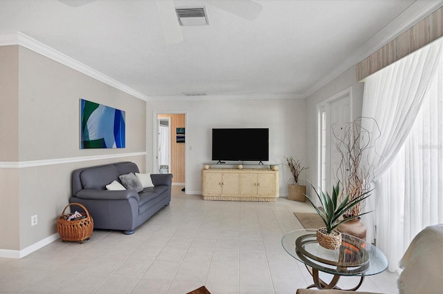 living area featuring ornamental molding, visible vents, ceiling fan, and light tile patterned floors
