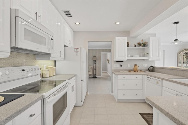 kitchen with open shelves, white appliances, light countertops, and visible vents