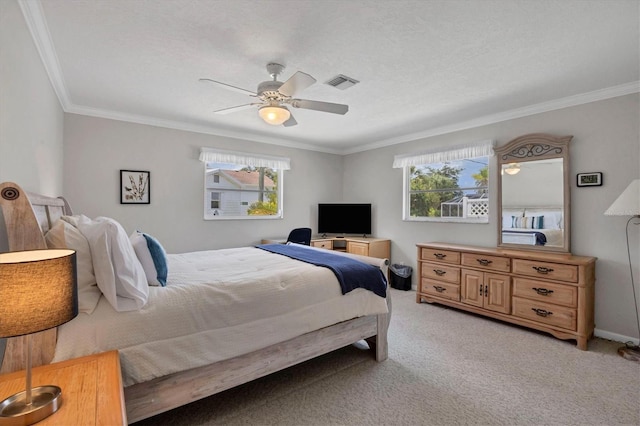 bedroom with ceiling fan, ornamental molding, visible vents, and light colored carpet