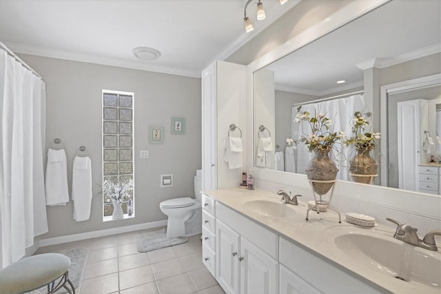 bathroom with toilet, tile patterned flooring, ornamental molding, and a sink