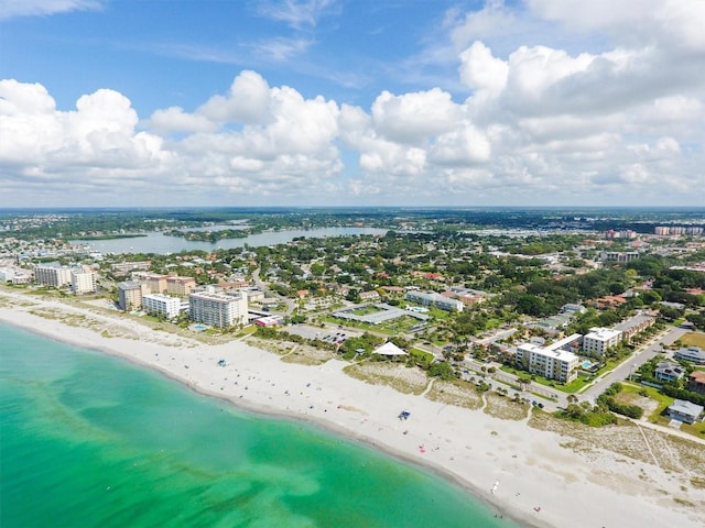 aerial view with a view of the beach, a water view, and a city view