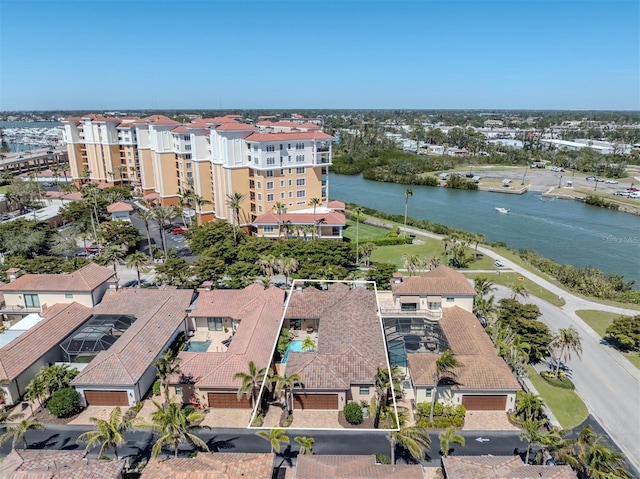 drone / aerial view with a residential view and a water view