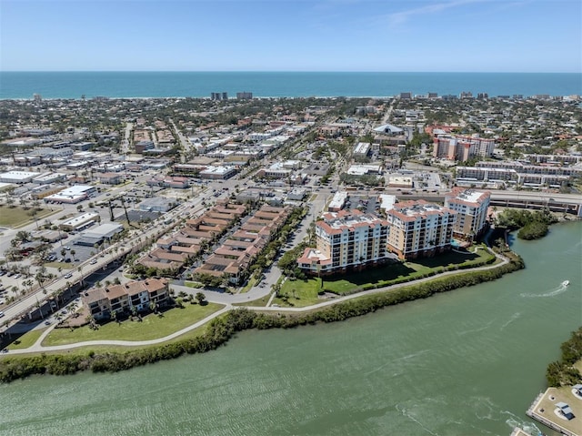 drone / aerial view featuring a view of city and a water view