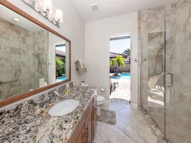 bathroom with toilet, marble finish floor, a stall shower, baseboards, and vanity