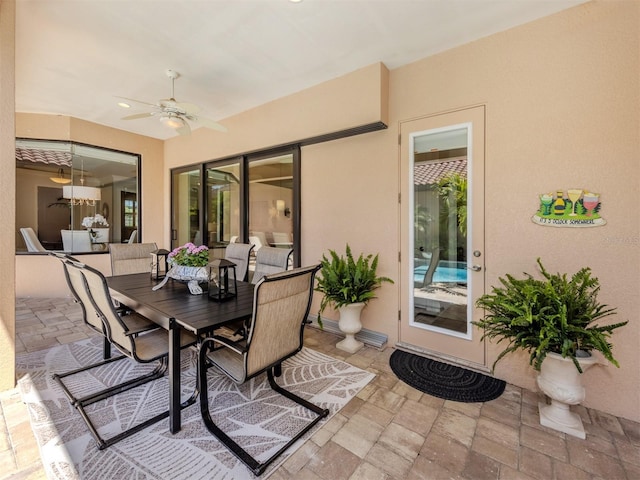 view of patio / terrace featuring outdoor dining area and ceiling fan