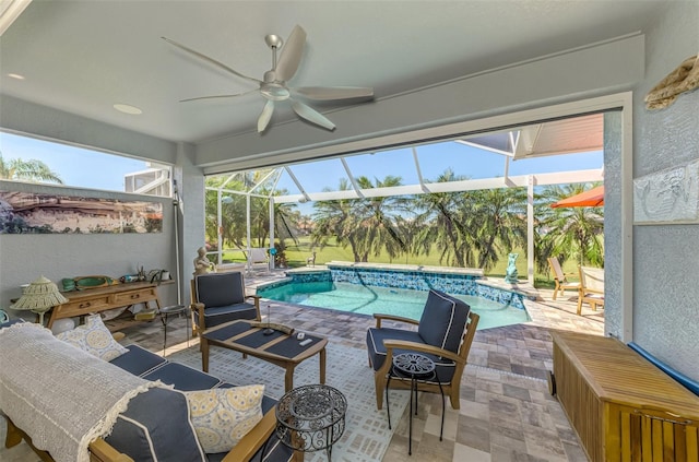 sunroom / solarium with a ceiling fan and a swimming pool