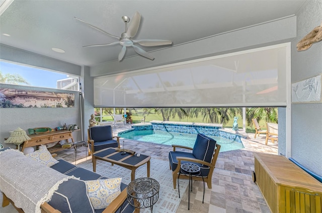 exterior space featuring a patio area, glass enclosure, and a ceiling fan