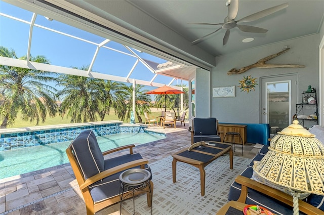 view of patio with an outdoor pool, a lanai, and ceiling fan