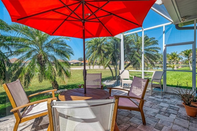 view of patio / terrace featuring a lanai