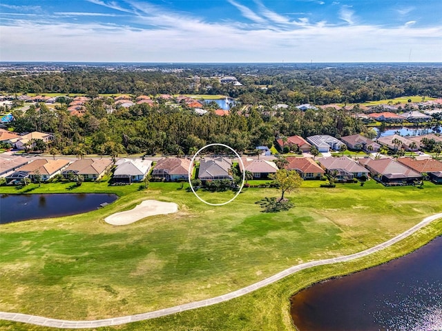 drone / aerial view featuring a water view and a residential view