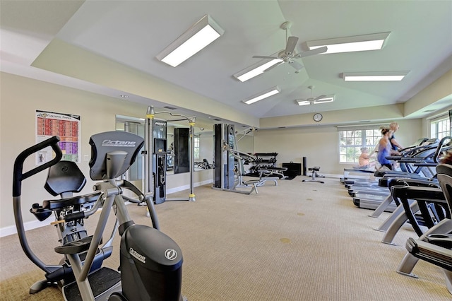 workout area featuring a ceiling fan, lofted ceiling, baseboards, and carpet