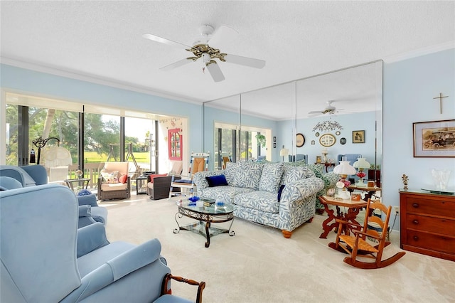 carpeted living room with ceiling fan, crown molding, and a textured ceiling