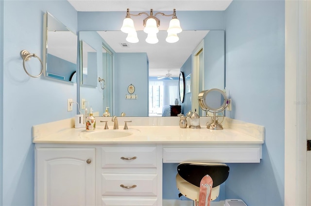 ensuite bathroom featuring visible vents, ensuite bathroom, ceiling fan, and vanity