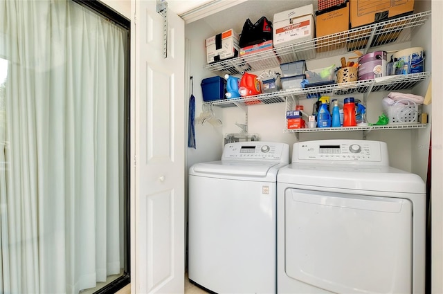 clothes washing area featuring laundry area and independent washer and dryer