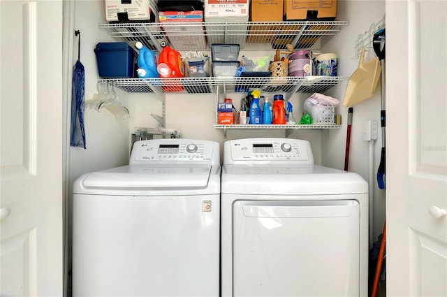 laundry room with washer and dryer and laundry area