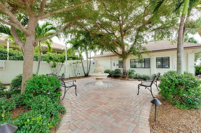 view of patio featuring fence