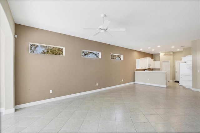 unfurnished living room with light tile patterned flooring, ceiling fan, baseboards, and recessed lighting