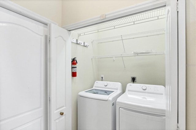 laundry room featuring laundry area and washing machine and clothes dryer