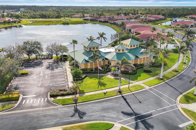 bird's eye view with a residential view and a water view