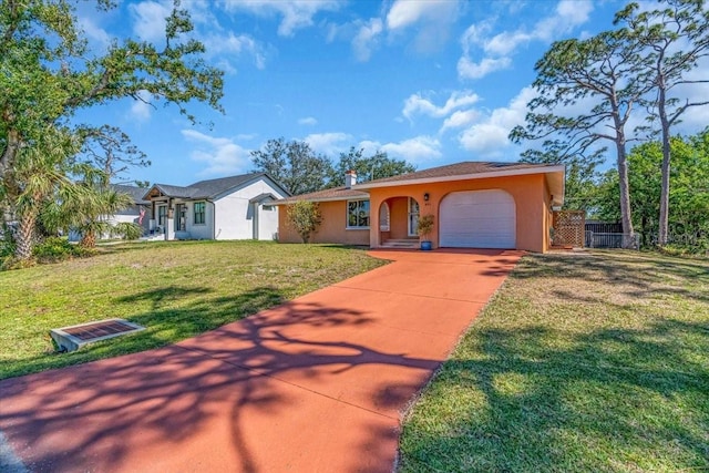 view of front of property with stucco siding, concrete driveway, an attached garage, fence, and a front lawn