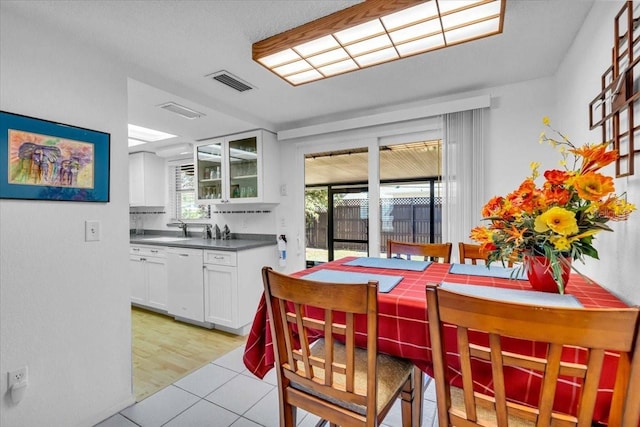 dining area featuring visible vents and light wood finished floors