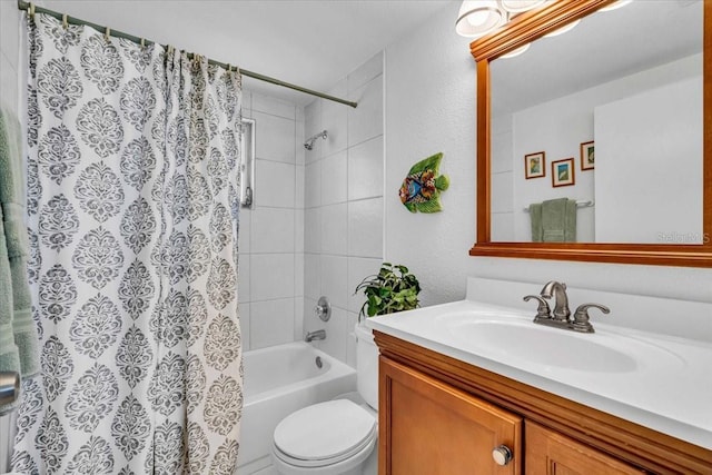 full bath with toilet, a textured wall, vanity, and shower / tub combo with curtain