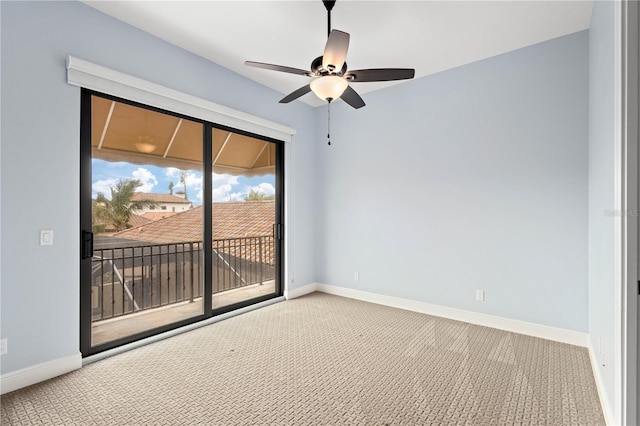 spare room featuring carpet floors, ceiling fan, and baseboards