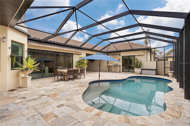 pool featuring a lanai, outdoor dining area, and a patio