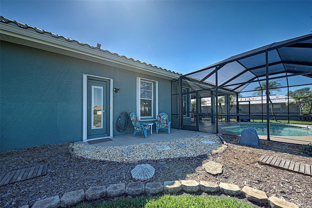 view of patio featuring a lanai and an outdoor pool