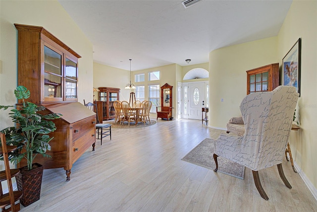 entryway with wood finished floors