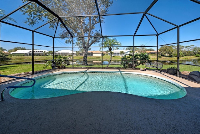 outdoor pool with a patio area and a lanai