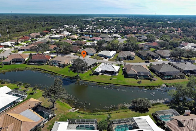 bird's eye view featuring a water view and a residential view