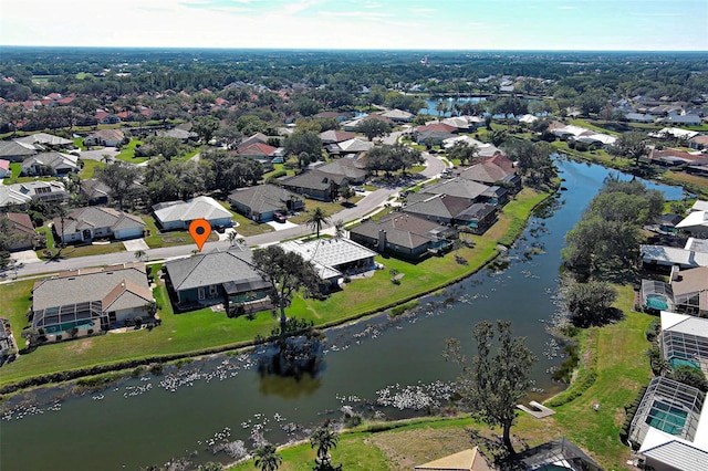 drone / aerial view featuring a residential view and a water view