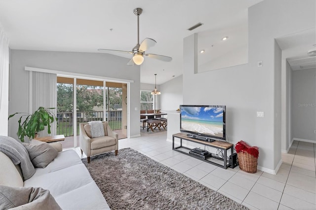 living room featuring light tile patterned floors, visible vents, plenty of natural light, and a ceiling fan