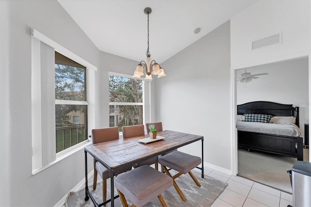 dining area featuring visible vents, baseboards, lofted ceiling, light tile patterned flooring, and a notable chandelier