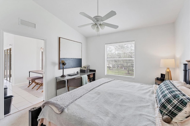 tiled bedroom with visible vents, lofted ceiling, and a ceiling fan