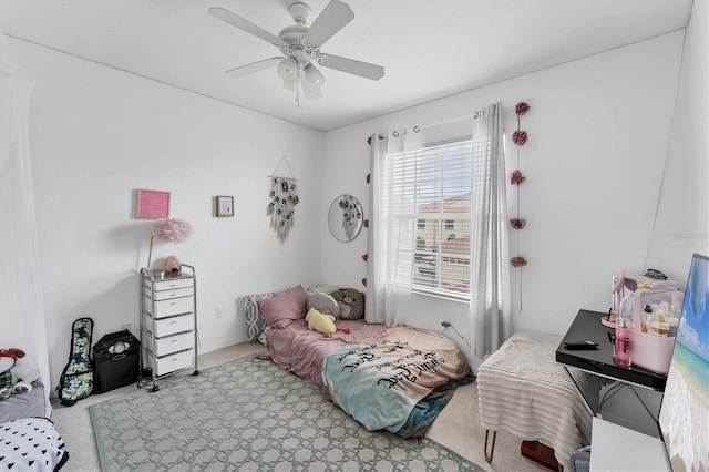 bedroom with a ceiling fan and carpet floors