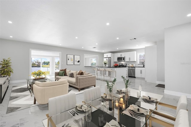 dining space featuring recessed lighting, visible vents, baseboards, and marble finish floor