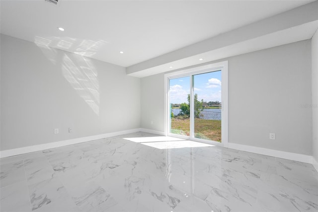 unfurnished room featuring recessed lighting, marble finish floor, and baseboards