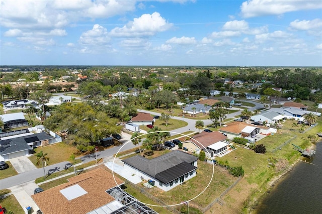 bird's eye view with a residential view and a water view