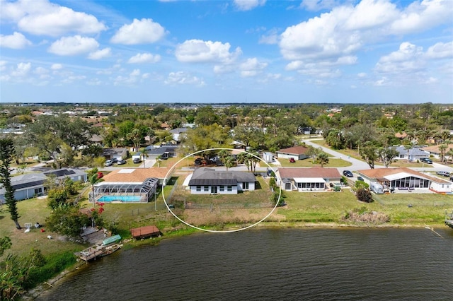 birds eye view of property featuring a residential view and a water view