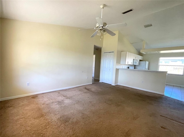 unfurnished living room with visible vents, high vaulted ceiling, a ceiling fan, carpet, and baseboards