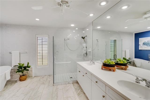 bathroom with a shower with shower door, marble finish floor, a ceiling fan, and a sink