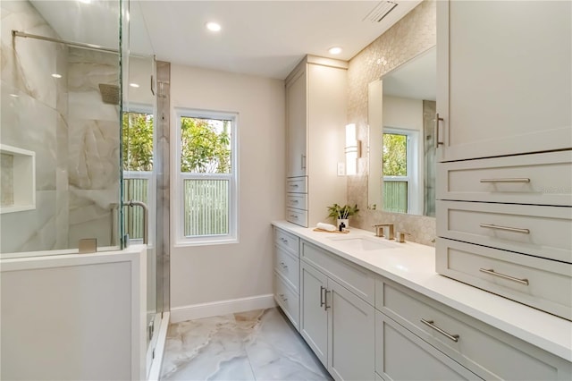 bathroom with vanity, a shower stall, visible vents, and marble finish floor