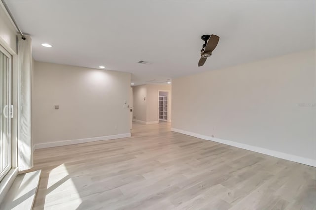 unfurnished room featuring visible vents, recessed lighting, baseboards, and light wood finished floors