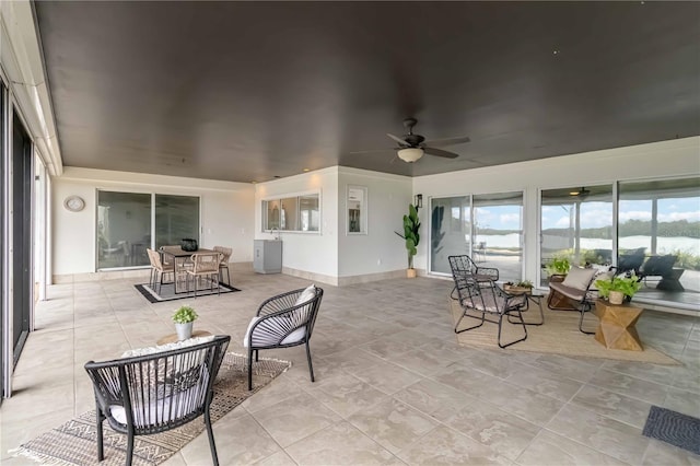 sunroom with a ceiling fan