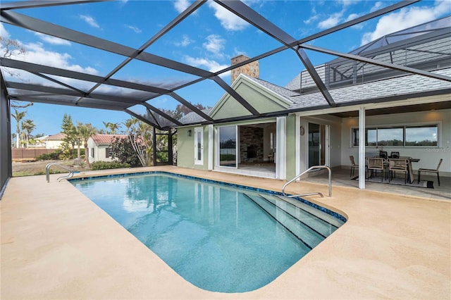 pool with a patio area and a lanai