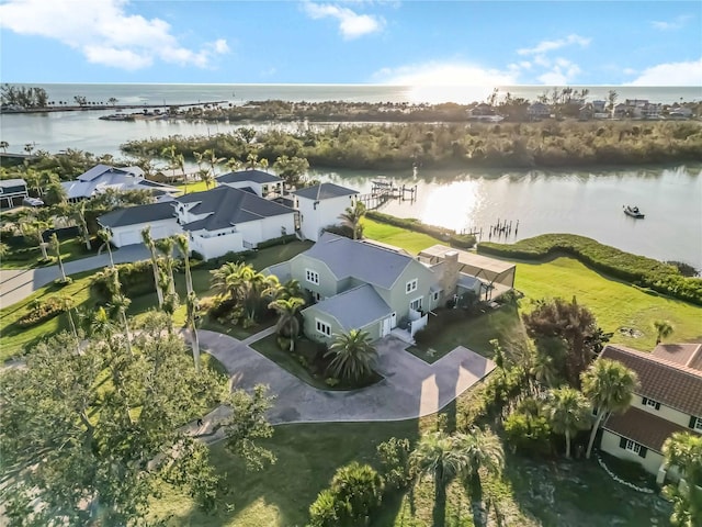 birds eye view of property with a water view