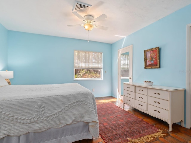 bedroom featuring visible vents and ceiling fan